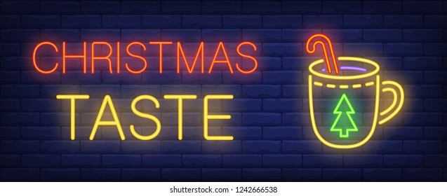 Christmas taste neon text and cup with candy cane. Christmas advertisement design. Night bright neon sign, colorful billboard, light banner. Vector illustration in neon style.