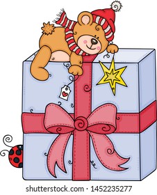Christmas teddy bear embellishing a big gift box
