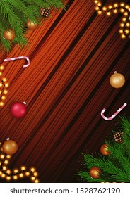 Christmas template for your arts with copy space, garland, Christmas tree branch and candy cane on the wooden background