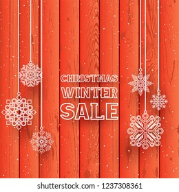 Christmas text on red wood background. Snowfall on wood backdrop. Hanging white line snowflakes