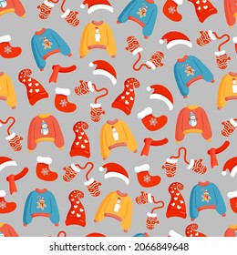 Christmas texture with festive clothes, sweaters, hats, mittens and socks. Vector illustration of Merry Christmas and Happy New Year. Seamless pattern. Winter holiday