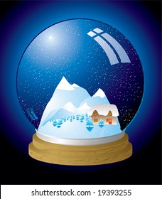 Christmas themed snow globe with a chocolate box cottage