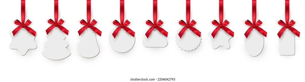 Christmas toys realistic illustrations set. Winter holidays decorations. New year blank tags, labels with red ribbons pack. Paperboard various shapes pendants collection isolated on white background.