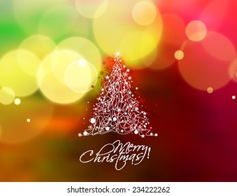 Christmas tree in the blur background with space for text