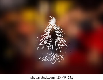 Christmas tree in the blur background with space for text