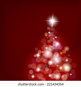 Christmas tree with blurred lights on red background.
