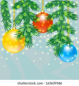 Christmas tree branch with baubles on blue background 