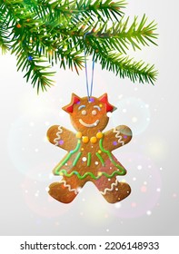 Christmas tree branch with decorative cookie. Gingerbread woman hanging on pine twig