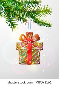 Christmas tree branch with decorative cookie. Gingerbread gift symbol hanging on pine twig