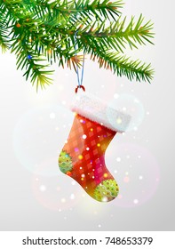 Christmas tree branch with decorative red sock. Empty christmas stocking hanging on pine twig
