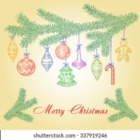 Christmas tree branch with holiday toys, balls and sweets as a card with space for text
