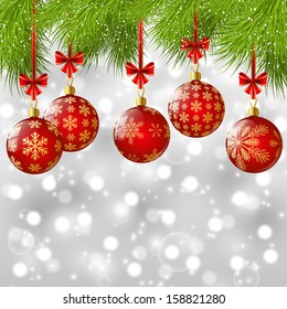 Christmas tree branches with red balls