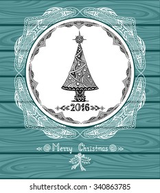 Christmas Tree in circle  in Zen doodle style with lace on blue wood background or creative Post Card or for decoration  of package, door in shop or for Christmas or New Year things