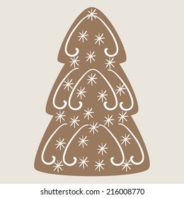 Christmas tree cookie decorated with vignettes and snowflakes on beige background