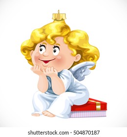 Christmas tree decorations toy little angel sit on gift box isolated on white background
