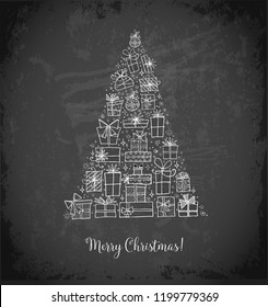 Christmas tree from gift boxes. Christmas card on blackboard background