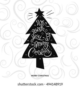 Christmas tree with hand drawn "We wish you a Merry Christmas' lettering text decoration element over beautiful background vector illustration. 