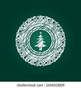 christmas tree icon drawn on a chalkboard