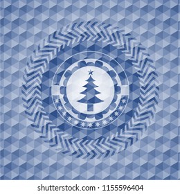 christmas tree icon inside blue badge with geometric background.