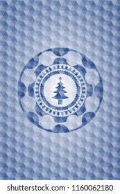 christmas tree icon inside blue emblem or badge with abstract geometric polygonal pattern background.