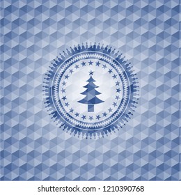 christmas tree icon inside blue polygonal emblem.