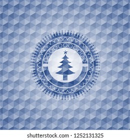 christmas tree icon inside blue polygonal emblem.