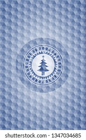 christmas tree icon inside blue badge with geometric pattern.