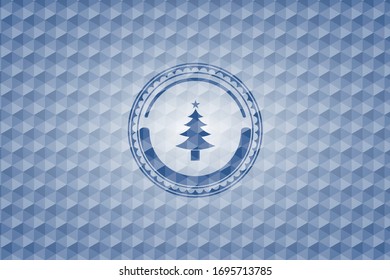 christmas tree icon inside blue emblem with geometric pattern background.