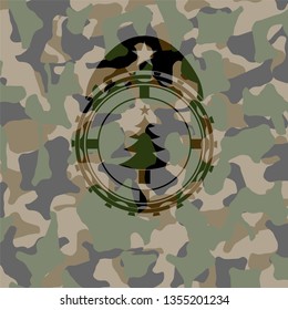 christmas tree icon inside camouflaged emblem