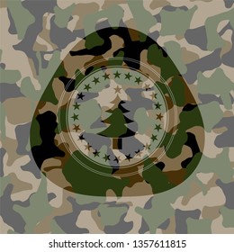 christmas tree icon inside camouflaged emblem