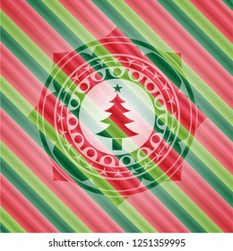 christmas tree icon inside christmas colors style emblem.