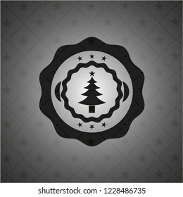 christmas tree icon inside dark badge or emblem