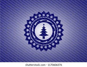 christmas tree icon inside emblem with jean high quality background