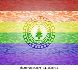 christmas tree icon inside emblem on mosaic background with the colors of the LGBT flag