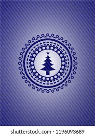 christmas tree icon inside emblem with jean texture