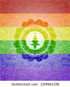 christmas tree icon inside emblem on mosaic background with the colors of the LGBT flag