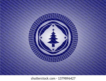 christmas tree icon inside emblem with jean texture
