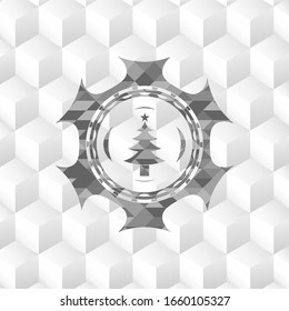 christmas tree icon inside grey emblem with cube white background