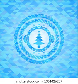 christmas tree icon inside light blue emblem. Mosaic background