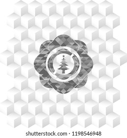 christmas tree icon inside realistic grey emblem with cube white background