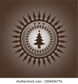 christmas tree icon inside realistic wooden emblem