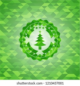 christmas tree icon inside realistic green mosaic emblem