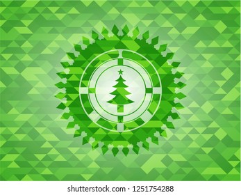 christmas tree icon inside realistic green emblem. Mosaic background