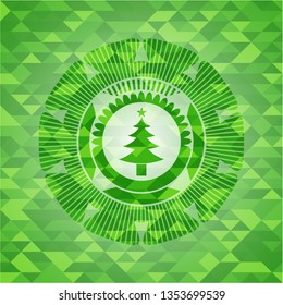 christmas tree icon inside realistic green emblem. Mosaic background