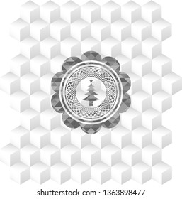 christmas tree icon inside realistic grey emblem with geometric cube white background