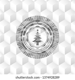 christmas tree icon inside realistic grey emblem with geometric cube white background