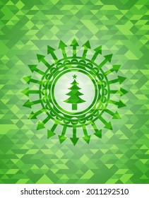 christmas tree icon inside realistic green emblem. Mosaic background. 