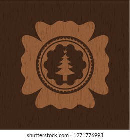 christmas tree icon inside retro wooden emblem