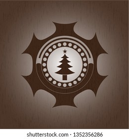 christmas tree icon inside retro style wooden emblem