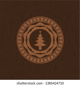 christmas tree icon inside retro style wooden emblem